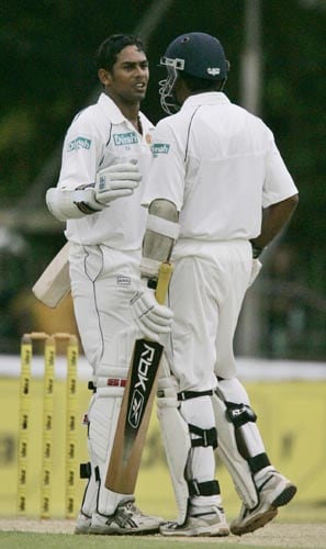 Sri Lanka's Malinda Warnapura (left) is congratulated by Sri Lanka captain Mahela Jayawardene after he reached his fifty against India on Day 1 of the first Test at the SSC Stadium on Wednesday. India vs SL, 1st Test, Day 1