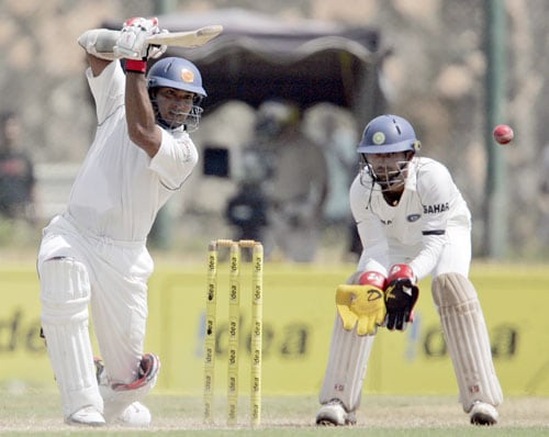 Kumar Sangakkara bats as Dinesh Karthik looks on during second day of the second Test match between India and Sri Lanka in Galle on August 1, 2008. (AP Photo) 2nd Test, Day 2: India vs SL