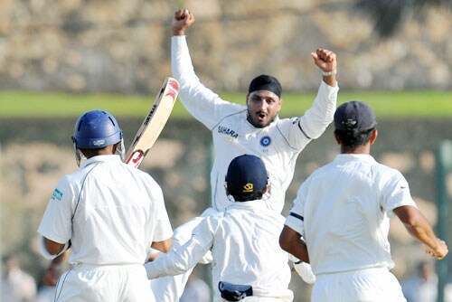 Harbhajan Singh celebrates with teammates after the dismissal of Thilan Samaraweera during the second day of the second Test match between India and Sri Lanka in Galle on August 1, 2008. (AFP Photo) 2nd Test, Day 2: India vs SL