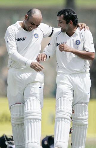 Virender Sehwag and Gautam Gambhir take a water break during third day of the second Test between India and Sri Lanka in Galle on August 2, 2008. 2nd Test, Day 3: India vs SL