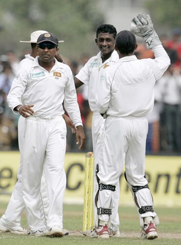 Ajantha Mendis, Prasanna Jayawardene and Mahela Jayawardene celebrate the dismissal of VVS Laxman during fourth day of the second Test between India and Sri Lanka in Galle on August 3, 2008. 2nd Test, Day 4: India vs SL