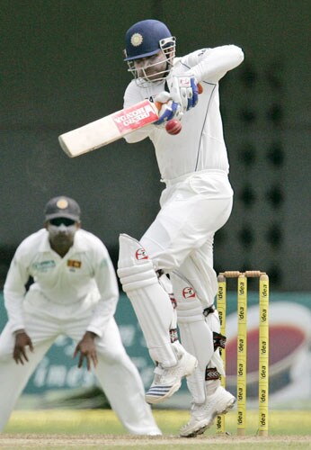Virender Shewag bats as Sri Lankan captain Mahela Jayawardene looks on during the first day of the third Test between India and Sri Lanka in Colombo on August 8. 3rd Test, Day 1: India vs SL