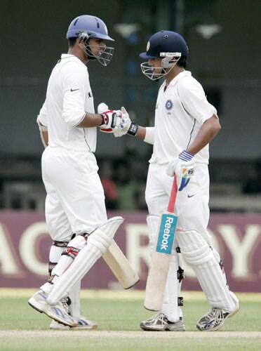 Rahul Dravid congratulates teammate Gautam Gambhir for completing a half-century during the first day of the third Test between India and Sri Lanka in Colombo on August 8. 3rd Test, Day 1: India vs SL