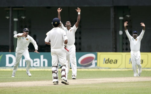 Prasad Dhammika, Michael Vandort and Mahela Jayawardene celebrate the dismissal of Sachin Tendulkar (unseen) during the first day of the third Test between India and Sri Lanka in Colombo on August 8. 3rd Test, Day 1: India vs SL