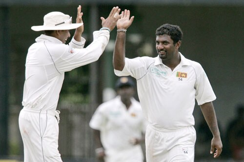 Muttiah Muraitharan celebrates with Tillakaratne Dilshan the dismissal of Sourav Ganguly during the first day of the third Test between India and Sri Lanka in Colombo on August 8. 3rd Test, Day 1: India vs SL