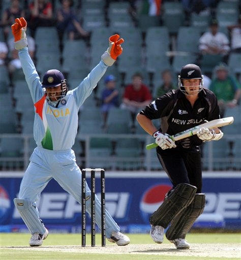 Mahendra Singh Dhoni, left, celebrates after a successfully appeal for LBW against New Zealand's batsman Peter Fulton, right, during their Super Eight's Twenty20 World Championship cricket match against New Zealand at the Wanderers Stadium in Johannesburg, South Africa, Sunday, Sept. 16, 2007. India vs New Zealand
