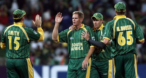 South Africa's Shaun Pollock, center, along with his team mates celebrate the dismissal of India's Gautam Gambhir during their Twenty20 World Championship Cricket match in Durban, South Africa, Thursday, Sept. 20, 2007. India vs South Africa