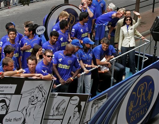 Bollywood actress Shilpa Shetty, far right, waves on top of the Rajasthan Royals bus during a parade through the streets of Cape Town, ahead of the Indian Premier League Twenty20 cricket matches to be held over the weekend in Cape Town. (AP Photo) IPL-II caravan rolls out in SA