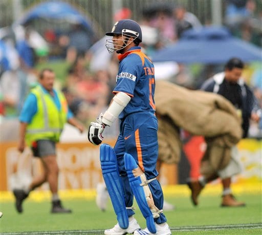 Sachin Tendulkar leaves the pitch as the grounds men bring on the covers when rained stopped play against New Zealand in their 1st one-day international match at McLean Park in Napier on Tuesday, March 3, 2009. (AP Photo) India vs New Zealand: 1st ODI