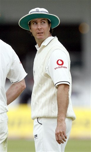 England's Michael Vaughan looks behind him as he leaves the pitch because of bad light with one Indian wicket standing, during the fifth day of the first Test Match against India at Lord's cricket ground, London on Monday. India vs England, 1st Test - Day 5