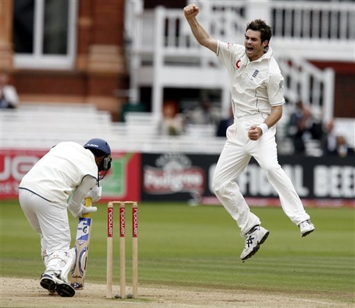 India's Dinesh Karthik, left, holds his stroke as England's James Anderson claims his wicket during the fifth day of the first Test at Lord's cricket ground, London on Monday. India vs England, 1st Test - Day 5