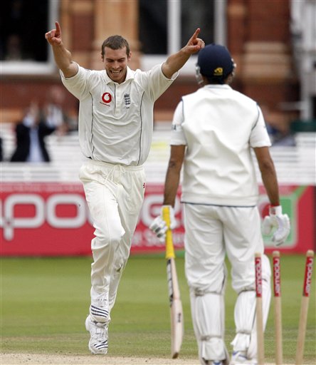 India's VVS Laxman, right, is bowled out by England's Chris Tremlett during the fifth day of the first Test Match at Lord's cricket ground, London on Monday. India vs England, 1st Test - Day 5