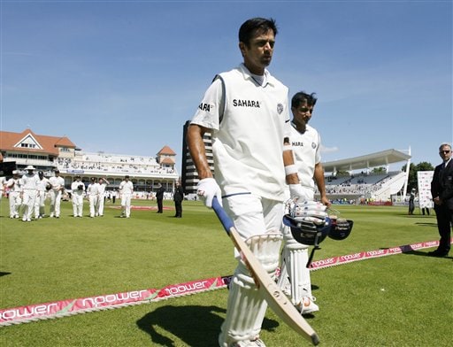 India's Rahul Dravid, left and Sourav Ganguly lead England from the field after winning the second Test cricket match at the Trent Bridge ground Nottingham on Tuesday. India win second Test