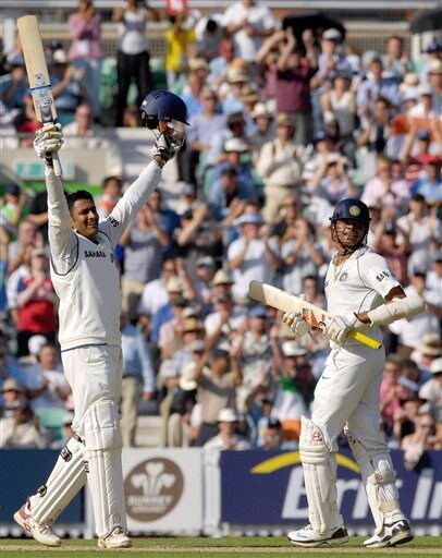 India's Anil Kumble, left, celebrates scoring his maiden century against England with his batting partner Shanthakumaran Sreesanth on the second day of the third cricket test match against England at The Oval, London on Friday. India vs England, 3rd Test - Day 2