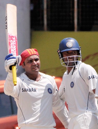 Virender Sehwag, left, celebrates his century with teammate Wasim Jaffer as South Africa's bowler Jacquis Kallis, right, walks during the third day of the first Test match of the Future Cup series in Chennai on Friday, March 28, 2008. South Africa scored 540 in first innings against India. Day 3: India vs SA, 1st Test