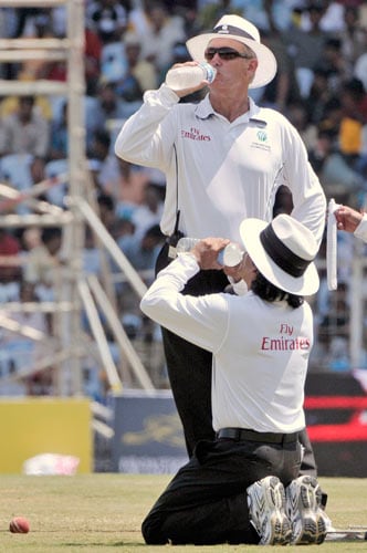 Umpires Asad Rauf, front, and Tony Hill drink water during third day of the first Test match of the Future Cup series in Chennai on Friday, March 28, 2008. South Africa scored 540 in first innings against India. Day 3: India vs SA, 1st Test