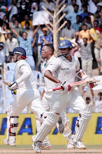 Rahul Dravid, right, and Virender Sehwag, left, take runs as South Africa's Makhaya Nitini, centre, looks on during third day of the first Test match of the Future Cup series in Chennai on Friday, March 28, 2008. South Africa scored 540 in first innings against India. Day 3: India vs SA, 1st Test