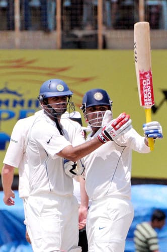 Rahul Dravid, left, congratulates teammate Virender Sehwag for scoring 150 runs against South Africa during third day of the first Test match of the Future Cup series in Chennai on Friday, March 28, 2008. South Africa scored 540 in first innings against India. Day 3: India vs SA, 1st Test