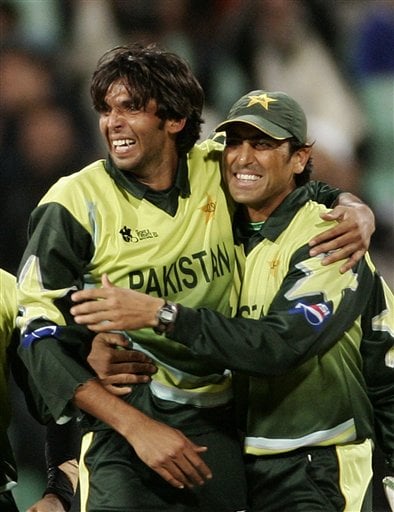 Pakistan cricket player Muhammad Asif, left and Younis Khan celebrate the dismissal of India's Dinesh Karthik during the Twenty20 World Championship Cricket in Durban, South Africa, Friday, Sept. 14, 2007. India vs Pakistan