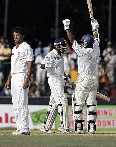 Sri Lanka captain Mahela Jayawardene celebrates with Malinda Warnapura after hitting the winning runs, while Sourav Ganguly looks on. India vs SL, 3rd Test, Day 4
