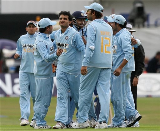 England's Matt Prior, right, looks at his wicket after being stumped by India's Mahendra Dhoni, centre, off the bowling of Sourav Ganguly, left, during the fifth one day International match at Headingley Cricket ground in Leeds, England, Sunday Sept. 2, 2007. India v England - 5th ODI