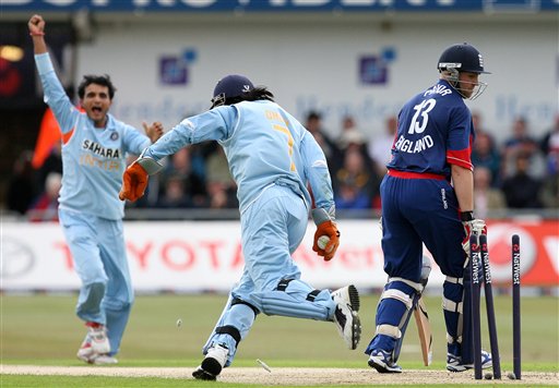 England's Matt Prior, right, looks at his wicket after being stumped by India's Mahendra Dhoni, centre, off the bowling of Sourav Ganguly, left, during the fifth one day International match at Headingley Cricket ground in Leeds, England, Sunday Sept. 2, 2007. India v England - 5th ODI
