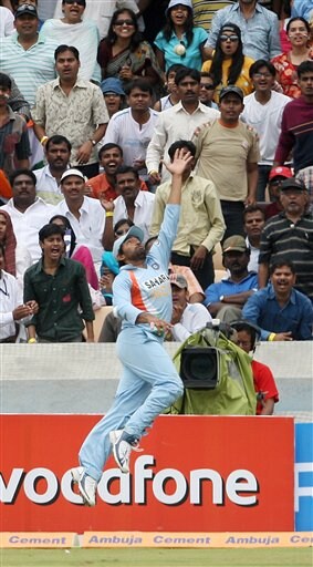 Robin Uthappa jumps to stop a shot from an Australian batsman during the third one day international cricket match against Australia in Hyderabad, India Friday Oct. 5, 2007. Ind v Aus - 3rd ODI