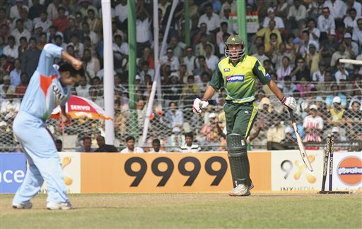 Sachin Tendulkar, left, celebrates the dismissal of Pakistan’s Shahid Afridi during their first one day international cricket match in Gauhati, India, Monday, Nov. 5, 2007. Ind v Pak - 1st ODI