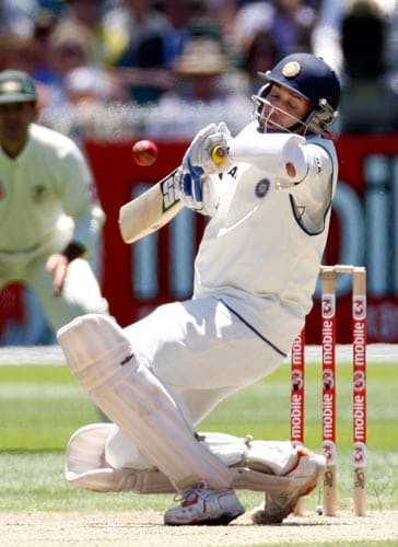VVS Laxman gets hit by a ball from Australia's Brett Lee as he was caught out by Ricky Ponting during the second day of their first Test cricket match at the Melbourne Cricket Ground in Melbourne on Thursday, December 27, 2007. 1st Test, Ind vs Aus - Day 2