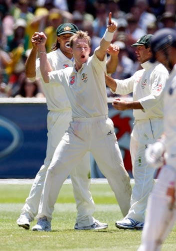 Brett Lee, center, celebrates with team mates after dismissing VVS Laxman during the second day of their first Test match against India at the Melbourne Cricket Ground on Thursday, December 27, 2007. 1st Test, Ind vs Aus - Day 2