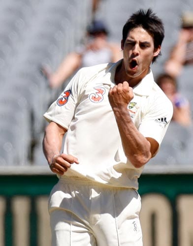 Mitchell Johnson celebrates taking the wicket of MS Dhoni during the fourth day of their first Test match at the Melbourne Cricket Ground on Saturday, December 29, 2007. 1st Test, Ind vs Aus - Day 4