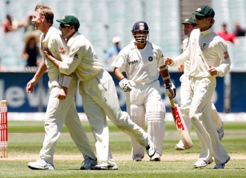 Sachin Tendulker, center, leaves the field after being dismissed for 15 runs during the fourth day of their first Test match against Australia at the Melbourne Cricket Ground on Saturday, December 29, 2007, in Melbourne. 1st Test, Ind vs Aus - Day 4