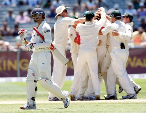 Australian players celebrate the wicket of Rahul Dravid, left, during the fourth day of their first Test match at the Melbourne Cricket Ground on Saturday, December 29, 2007. 1st Test, Ind vs Aus - Day 4