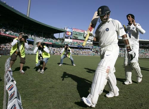 Sachin Tendulkar, second from right, waves his bat as he walks off with a score of 154 not out at the end of India's first innings against Australia at the Sydney Cricket Ground on Friday, January 4, 2008, on the third day of their second cricket Test. India made 532 in reply to Australia's 463 in their first innings. 2nd Test, Ind vs Aus - Day 3