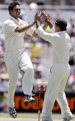 Ricky Ponting, right, celebrates with Mitchell Johnson who took the wicket of Virender Sehwag for 29 runs at the WACA in Perth on Wednesday, January 16, 2008, on the first day of their third Test match. Australia lead the series 2-0. 3rd Test, Ind vs Aus - Day 1
