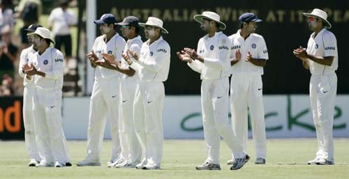 India's players applaud as Australia's batsman Adam Gilchrist runs onto the field at the Adelaide Oval on Sunday, January 27, 2008, on the fourth day of their fourth Test. India made a first innings total of 526. 4th Test, Ind vs Aus - Day 4
