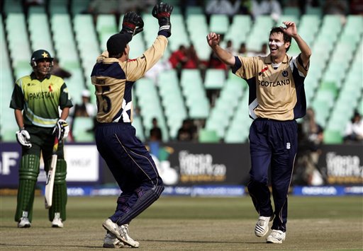 Scotland's Craig Wright, right, celebrates the dismissal of Pakistan's Shahid Afridi during their Twenty20 World Championship cricket match in Durban, South Africa, Wednesday Sept. 12, 2007 Pakistan vs Scotland