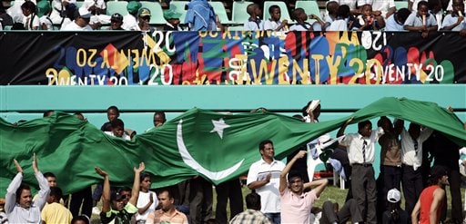Cricket fans raise Pakistan's national flag during the Twenty20 World Championship cricket match between Pakistan and Scotland in Durban, South Africa, Wednesday Sept. 12, 2007. Pakistan vs Scotland