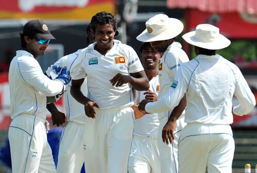 Thilan Thushara celebrates with Kumar Sangakkara and teammates Nuwan Kulasekara and Tharanga Paranavitana on the second day of the third and final Test at The Sinhalese Sports Club in Colombo. (AFP Photo) Pak vs SL: 3rd Test, Day 2