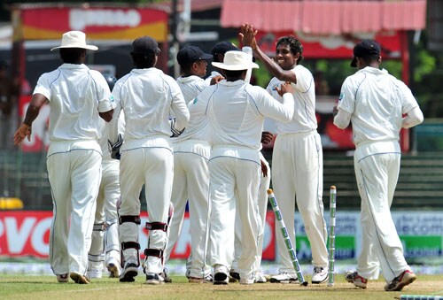 Thilan Thushara celebrates with teammates the dismissal of Saeed Ajmal on the second day of the third and final Test at The Sinhalese Sports Club in Colombo. (AFP Photo) Pak vs SL: 3rd Test, Day 2