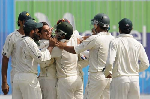 Saeed Ajmal celebrates with teammates after the dismissal of Thilan Samaraweera during the third day of the first Test match between Pakistan and Sri Lanka at The Galle International Stadium in Galle. (AFP Photo) Day 3: Pak vs SL, 1st Test