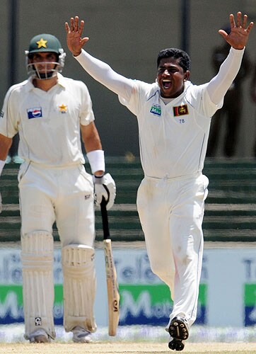 Rangana Herath celebrates the dismissal of Mohammad Yousuf during the third day of the third and final Test match between Sri Lanka and Pakistan at The Sinhalese Sports Club in Colombo. (AFP Photo) Pak vs SL: 3rd Test, Day 3