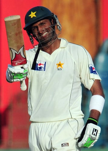 Shoaib Malik raises his bat in the air to celebrate scoring a century during the third and final Test match between Sri Lanka and Pakistan at The Sinhalese Sports Club in Colombo. (AFP Photo) Pak vs SL: 3rd Test, Day 3