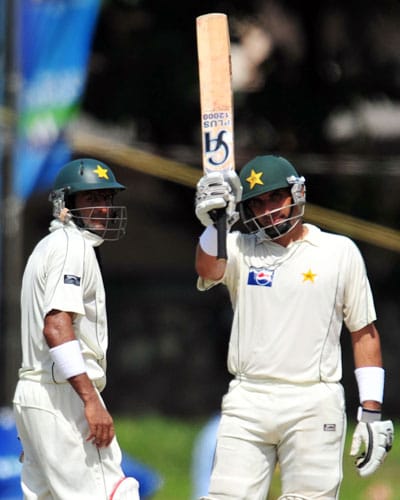 Misbah-ul-Haq raises his bat to the crowd after scoring a half-century as Shoaib Malik looks on during the third and final Test match between Sri Lanka and Pakistan at The Sinhalese Sports Club in Colombo. (AFP Photo) Pak vs SL: 3rd Test, Day 3