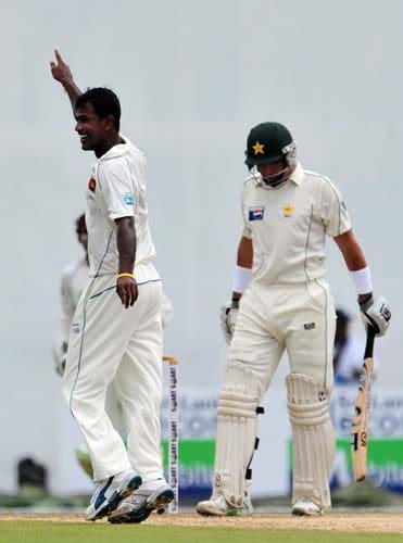 Nuwan Kulasekara celebrates the dismissal of Misbah-ul-Haq during the first day of the second Test match between Pakistan and Sri Lanka at The P. Saravanamuttu Stadium in Colombo. (AFP Photo) Day 1: Pak vs SL, 2nd Test