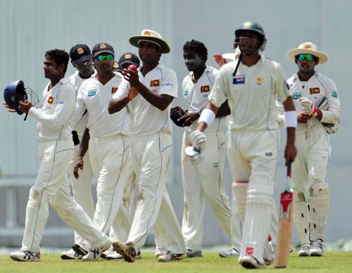 Sri Lankan cricketers leave the ground at the end of Pakistan's first 90-run innings during the first day of the second Test match between Pakistan and Sri Lanka at The P. Saravanamuttu Stadium. (AFP Photo) Day 1: Pak vs SL, 2nd Test