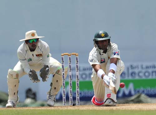 Shoaib Malik bats as Tillakaratne Dilshan looks on during the first day of the second Test match between Pakistan and Sri Lanka at The P. Saravanamuttu Stadium in Colombo. (AFP Photo) Day 1: Pak vs SL, 2nd Test