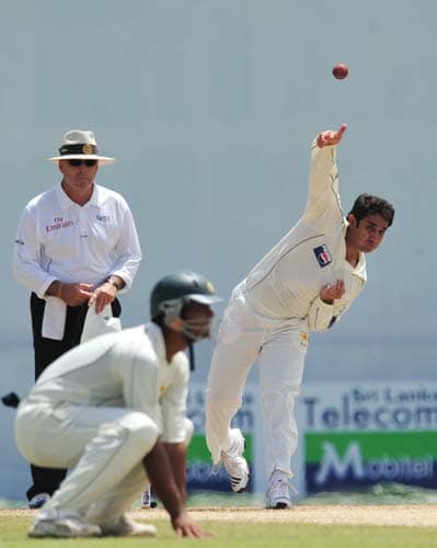 Saeed Ajmal delivers the ball as Australian umpire D.J. Harper looks on during the second day of the second Test match between Pakistan and Sri Lanka at The P. Saravanamuttu Stadium in Colombo. (AFP Photo) Day 2: Pak vs SL, 2nd Test