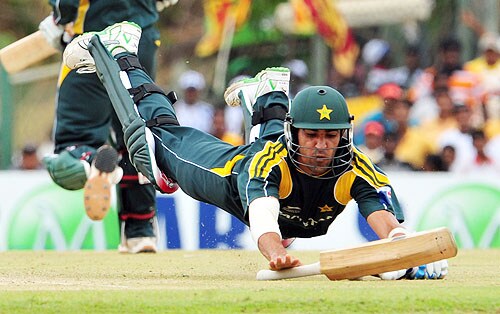 Umar Gul successfully completes a run by diving into the crease during the second One-Day International match between Sri Lanka and Pakistan in Dambulla. (AFP Photo) Pak vs SL: 2nd ODI
