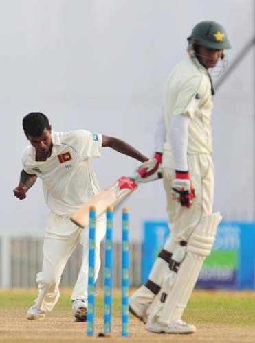 10. Nuwan Kulasekara celebrates dismissing Shoaib Malik during the second day of the first Test match between Pakistan and Sri Lanka at The Galle International Stadium in Galle. (AFP Photo) Day 2: Pak vs SL, 1st Test